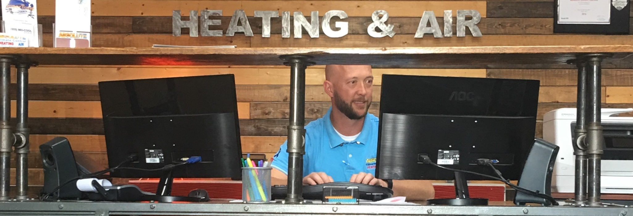 Jason sitting at the reception desk.